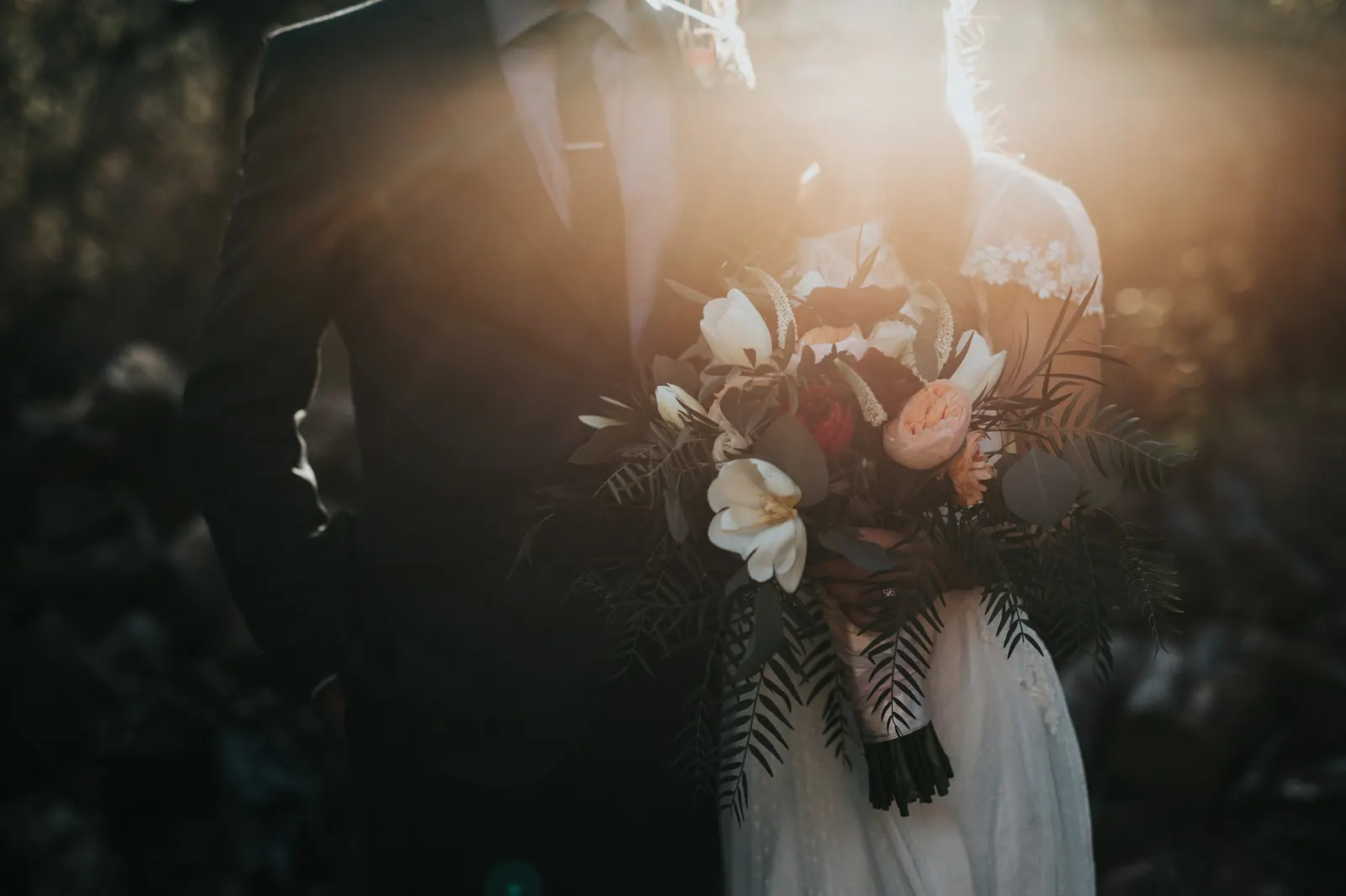 A bridal bouquet resting on linen in soft daylight